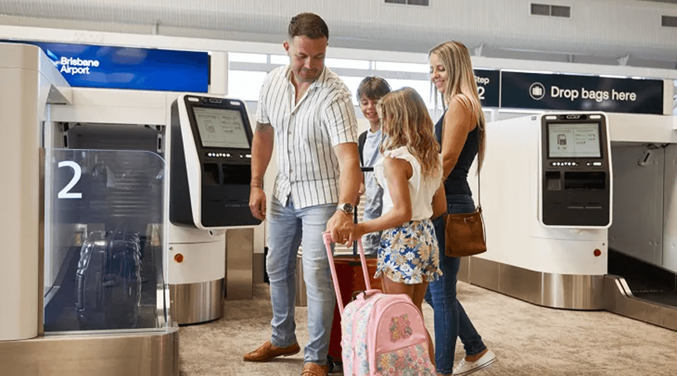 A family using the Amadeus bag drop system in Brisbane airport